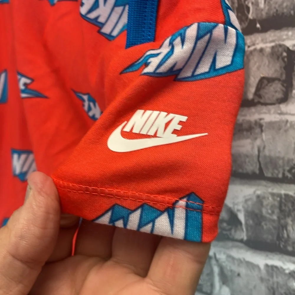 Nike baby onesie in orange  and‎ Blue